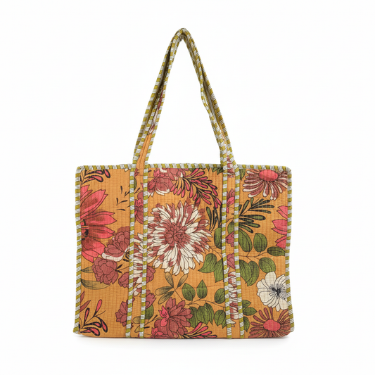 Mustard floral quilted tote bag from Draped In Heritage, showcasing the large-scale print and striped details on a light background.